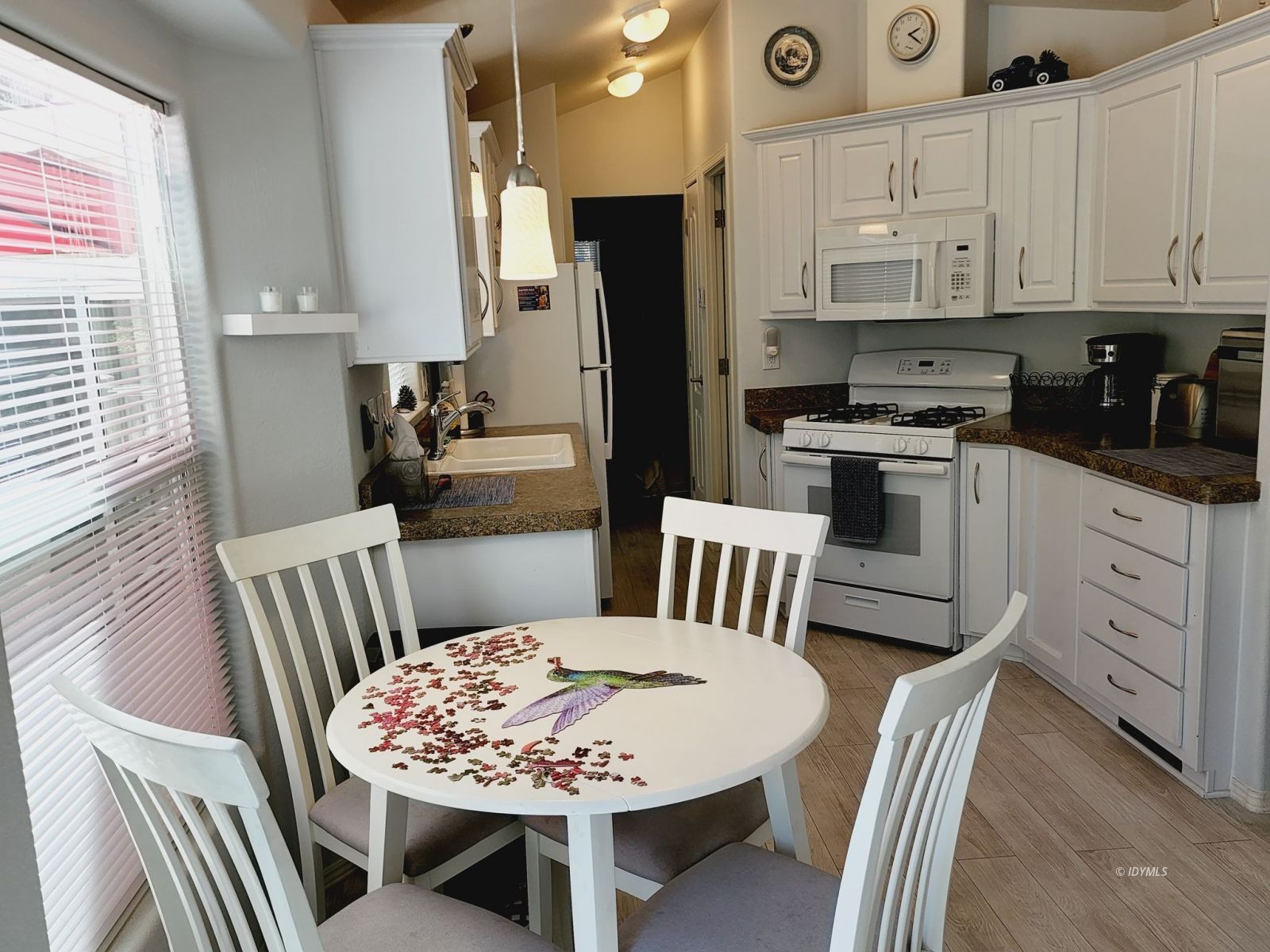 25955 Highway 243, Unit 45 Idyllwild, CA 92549 - Photo 13 of 25 a view of kitchen with cabinets and wooden floor
