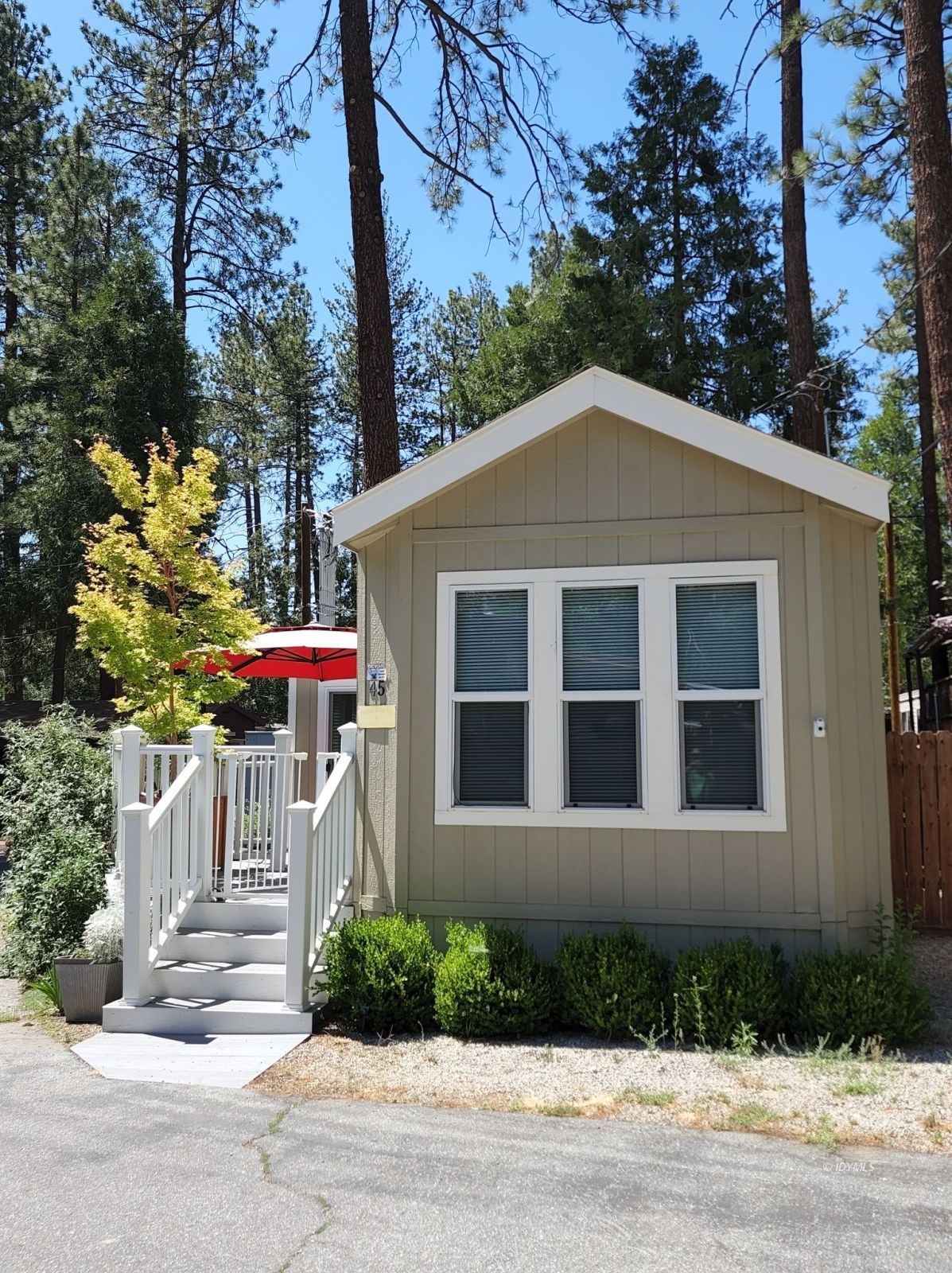25955 Highway 243, Unit 45 Idyllwild, CA 92549 - Photo 19 of 25 a front view of a house with a yard