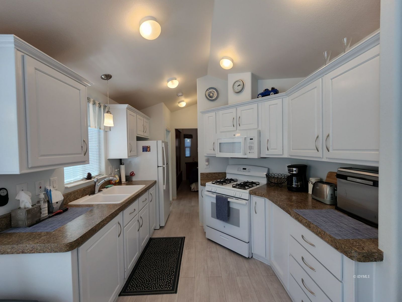 25955 Highway 243, Unit 45 Idyllwild, CA 92549 - Photo 7 of 25 a kitchen with granite countertop a sink stainless steel appliances and cabinets