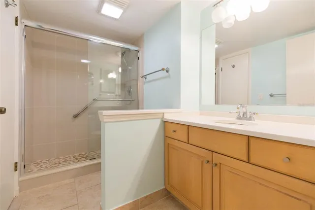 a bathroom with double sink and a mirror
