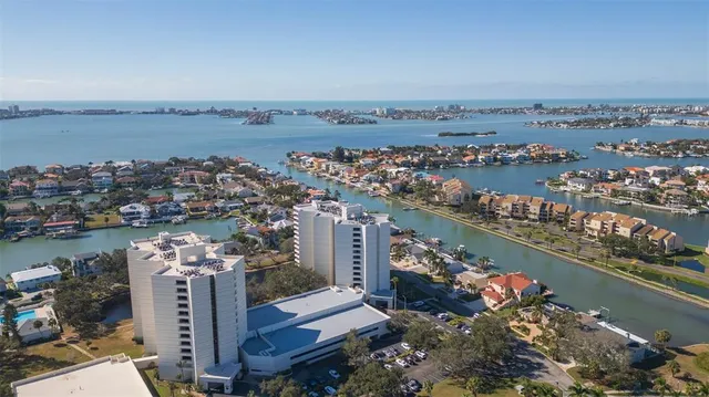 an aerial view of a residential building and lake view