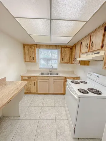 a utility room with cabinets dryer and washer