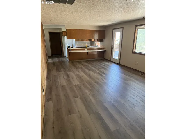 a kitchen with a sink and a stove