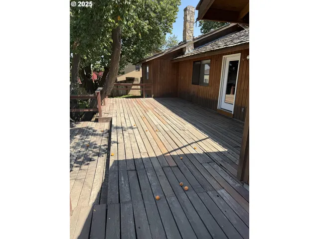 a pathway of a house with wooden floor