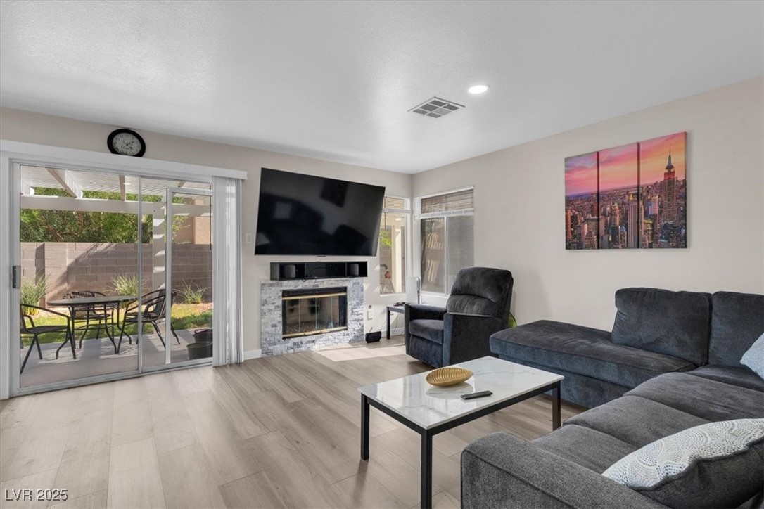 1219 Heather Ridge Road North Las Vegas, NV 89031 - Photo 15 of 32 Living room with wood finished floors, recessed li