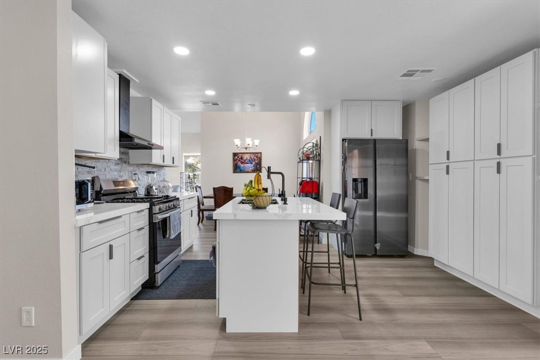 1219 Heather Ridge Road North Las Vegas, NV 89031 - Photo 17 of 32 Kitchen featuring stainless steel appliances, wall
