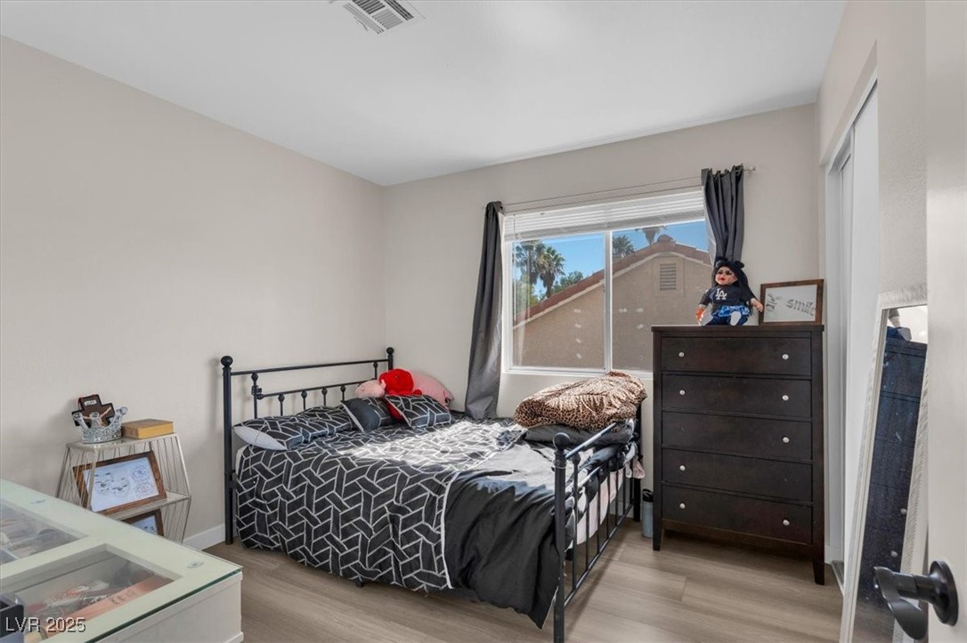 1219 Heather Ridge Road North Las Vegas, NV 89031 - Photo 24 of 32 Bedroom featuring wood finished floors