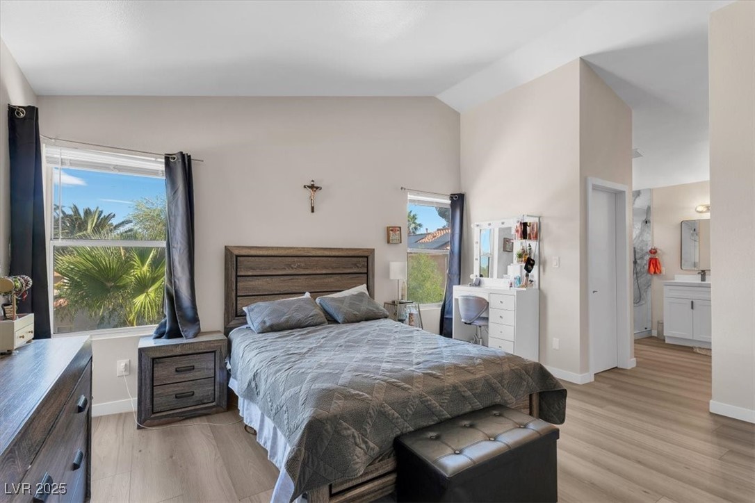 1219 Heather Ridge Road North Las Vegas, NV 89031 - Photo 28 of 32 Bedroom featuring lofted ceiling and light wood-st