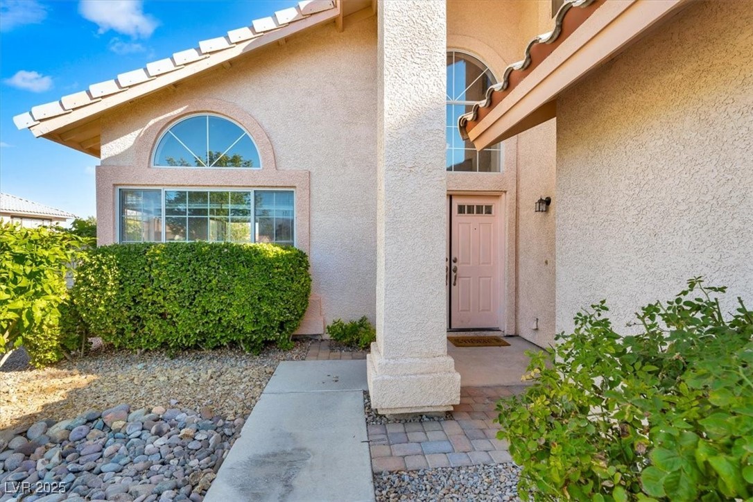 1219 Heather Ridge Road North Las Vegas, NV 89031 - Photo 4 of 32 Property entrance with stucco siding