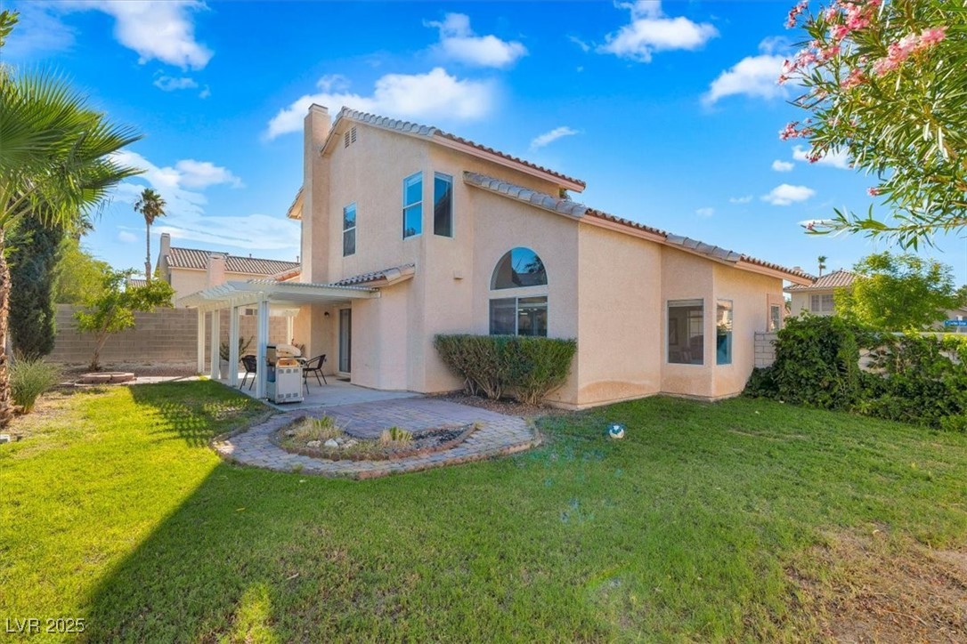 1219 Heather Ridge Road North Las Vegas, NV 89031 - Photo 6 of 32 Back of property with a pergola, stucco siding, a