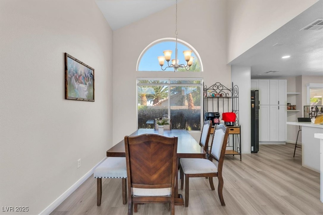 1219 Heather Ridge Road North Las Vegas, NV 89031 - Photo 9 of 32 Dining space with light wood finished floors, a ch