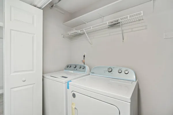 a utility room with dryer and washer
