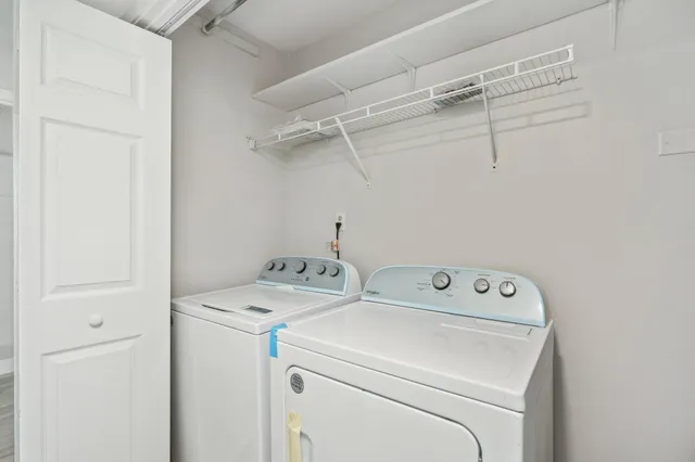 a utility room with dryer and washer