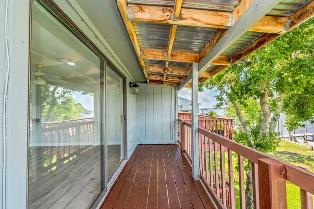 a view of a balcony with wooden floor