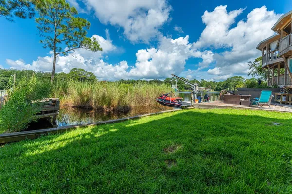 a view of a lake with a yard