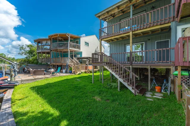 a view of a house with backyard and porch