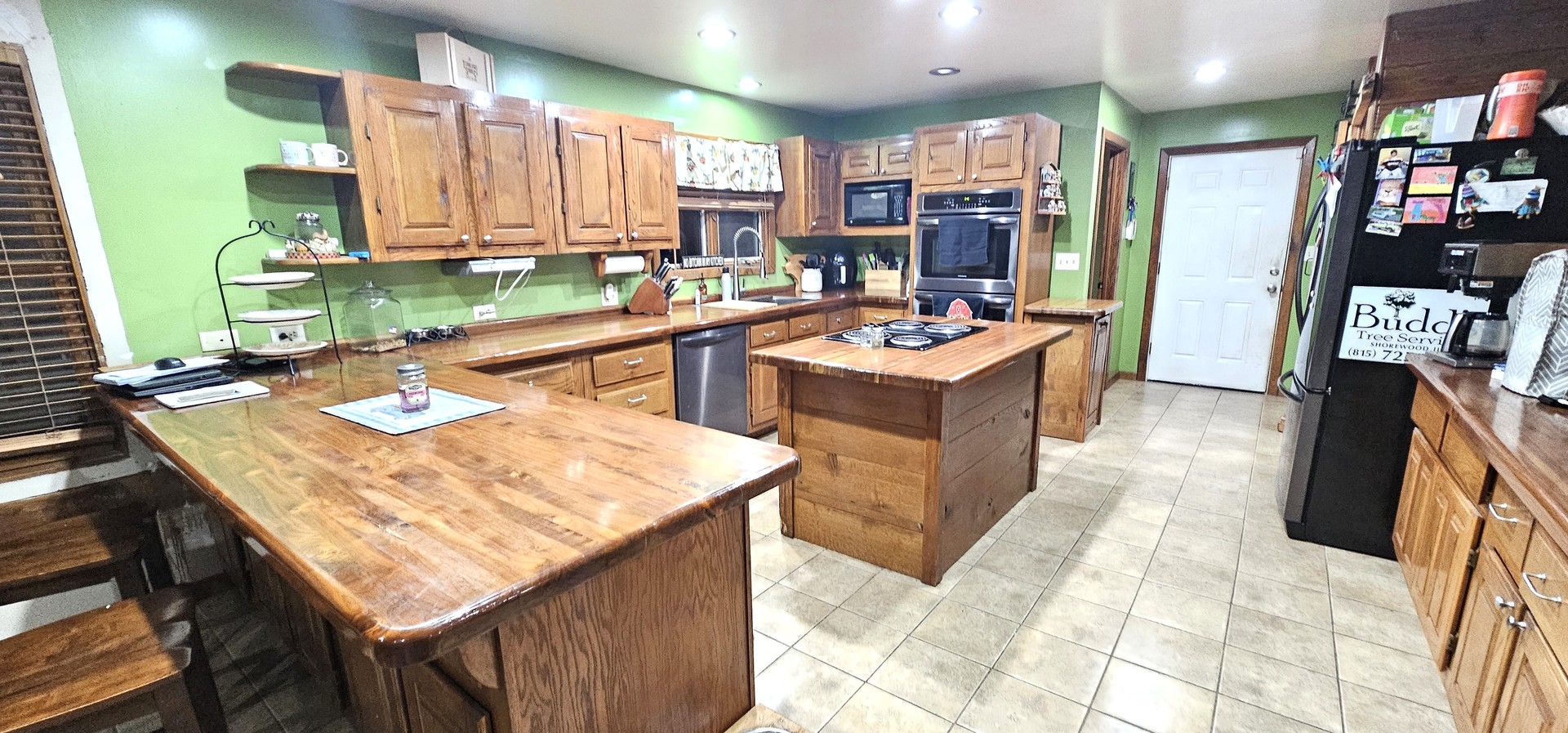 22116 Southwest Frontage Road Shorewood, IL 60404 - Photo 15 of 35 a kitchen with a sink a stove and a wooden cabinets