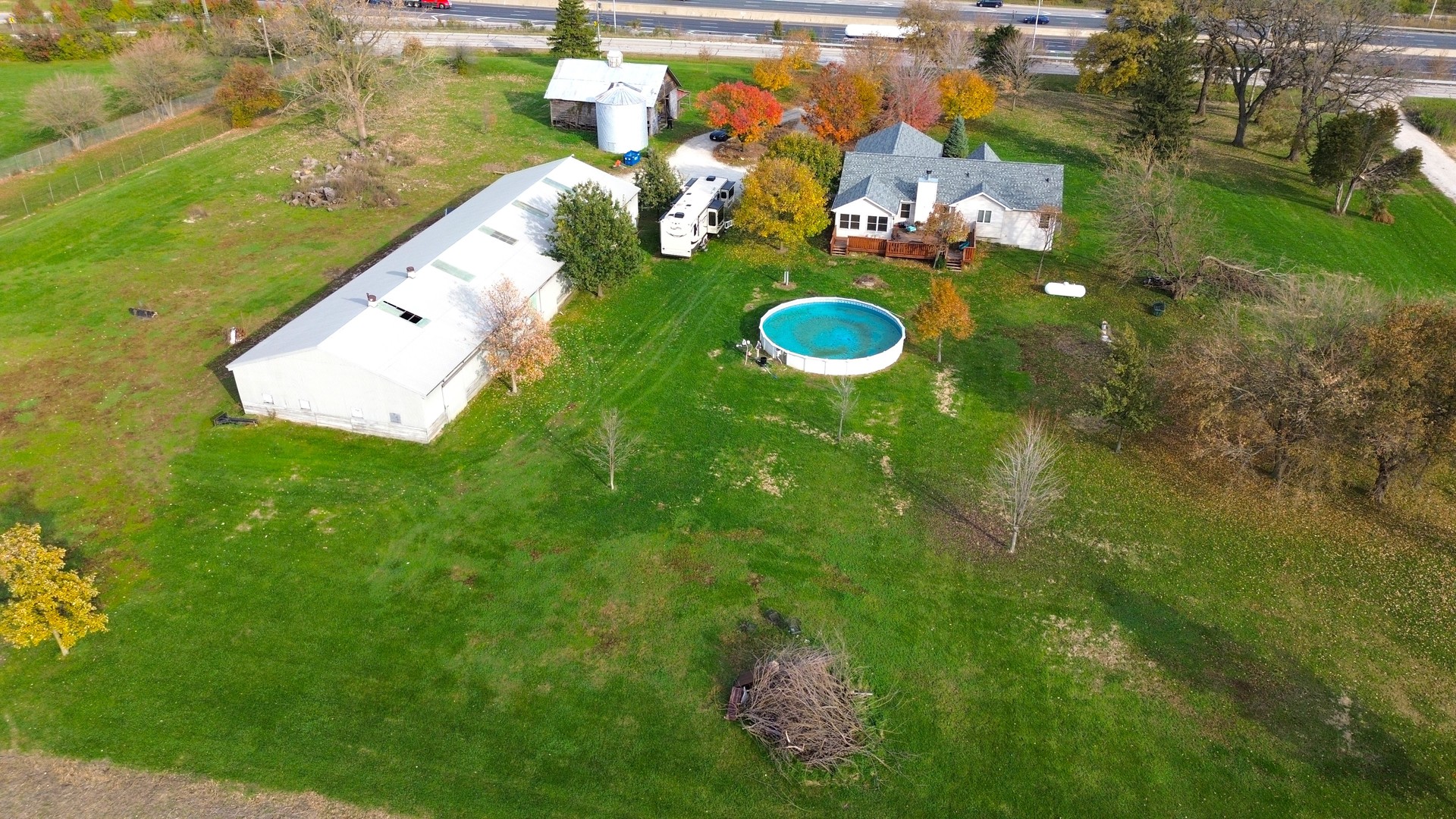 22116 Southwest Frontage Road Shorewood, IL 60404 - Photo 33 of 35 a view of a swimming pool with a yard