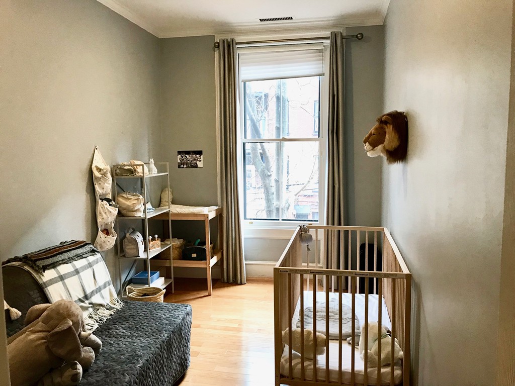 241 Beacon Street, Unit 3 Boston, MA 02116 - Photo 13 of 17 a bedroom with furniture and a window
