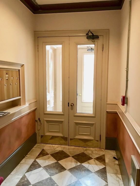 241 Beacon Street, Unit 3 Boston, MA 02116 - Photo 16 of 17 a view of an entryway with a window