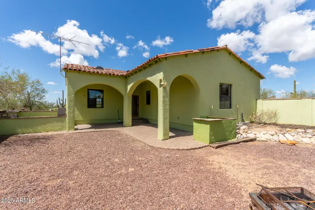 a view of a house with backyard space