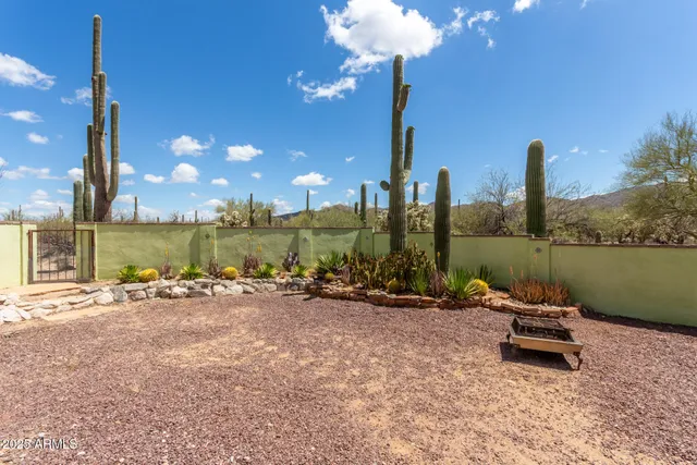 a lake view with a table and chairs