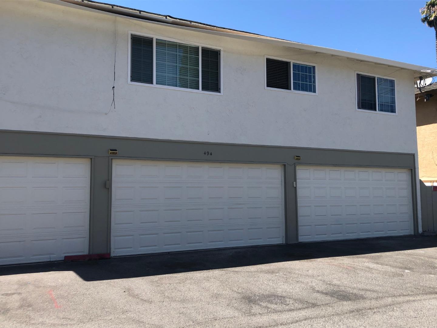 494 Greendale Way San Jose, CA 95129 - Photo 4 of 8 a black car parked in front of a building