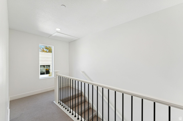 252 North Main Street Bountiful, UT 84010 - Photo 16 of 34 Corridor featuring light carpet and an upstairs landing