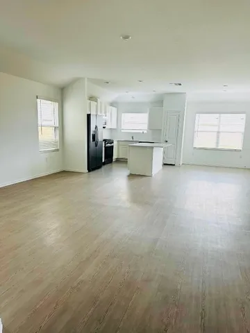 a view of a kitchen with a sink cabinets and a window