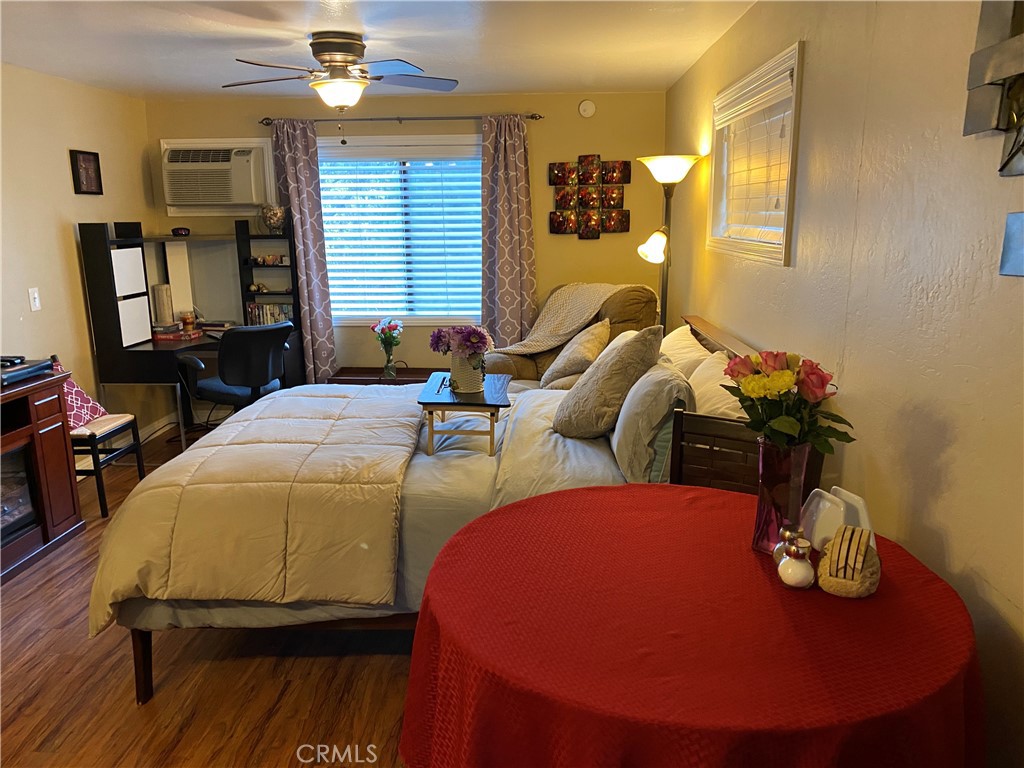 46011 Sandia Creek Drive, Unit C Temecula, CA 92590 - Photo 11 of 16 a bedroom with two beds and a lamp on dresser