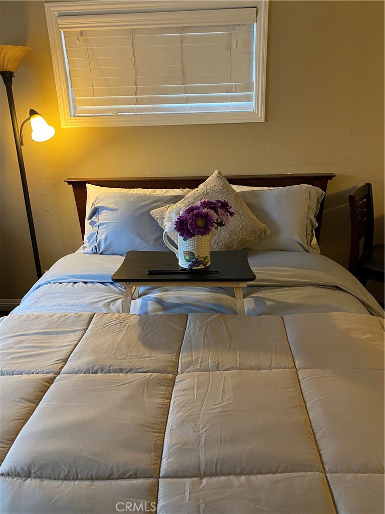 46011 Sandia Creek Drive, Unit C Temecula, CA 92590 - Photo 12 of 16 a bedroom with a bed and window