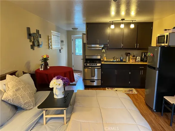 a kitchen with cabinets and appliances