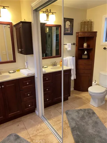 a bathroom with a sink vanity and a mirror