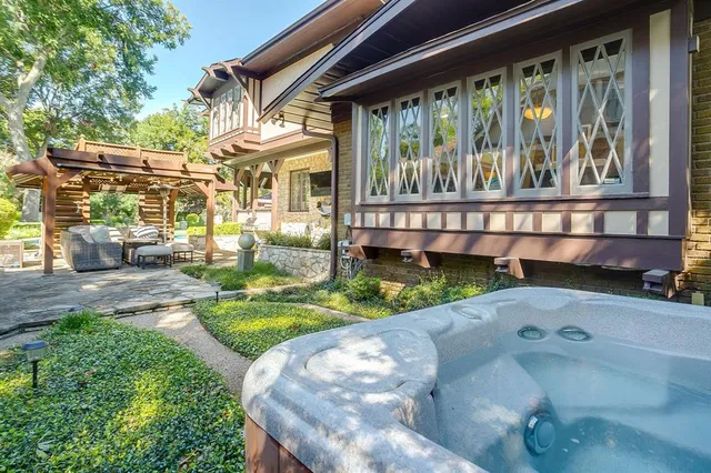 a front view of a house with a yard table and chairs