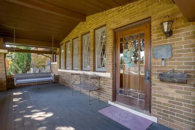 a view of pool with brick wall