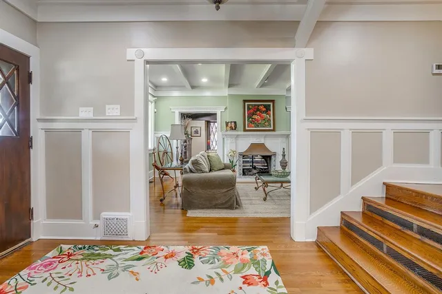 a living room with furniture and a rug