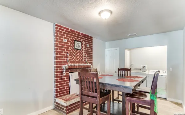 a view of a dining room with furniture and window