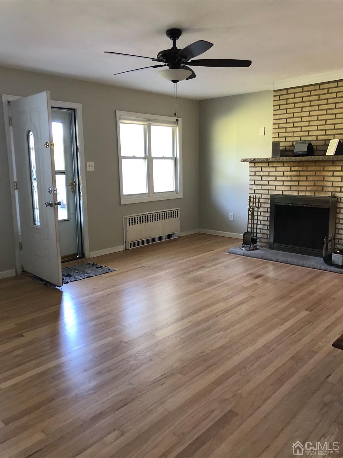 918 River Road Piscataway, NJ 08854 - Photo 4 of 23 The fireplace is woodburning.
