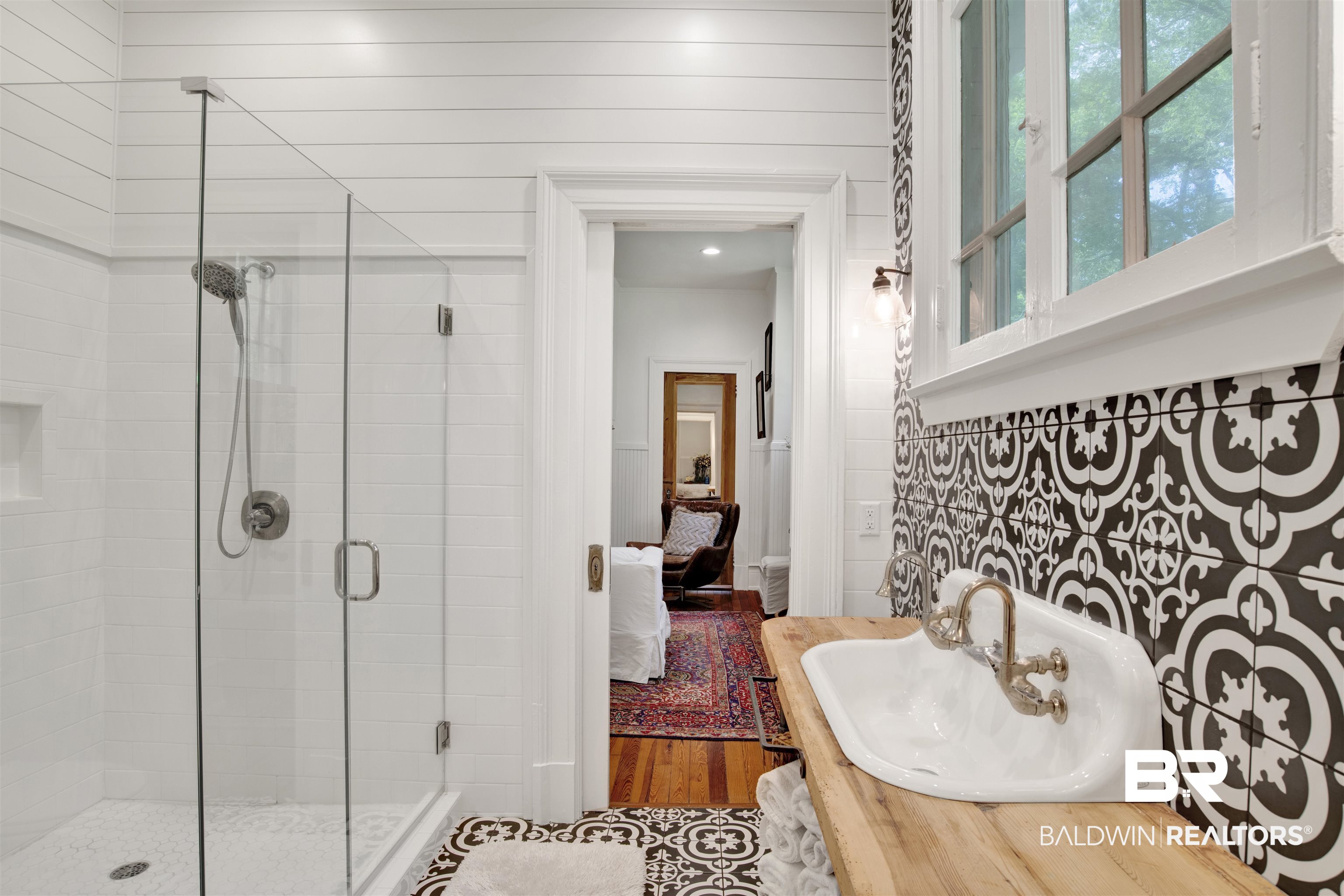 1654 Government Street Mobile, AL 36604 - Photo 37 of 45 Bathroom with a shower with door, hardwood / wood-style floors, and sink