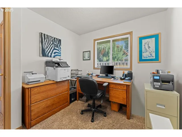 a workspace with furniture and a window