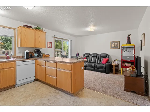 a utility room with sink dryer and washer