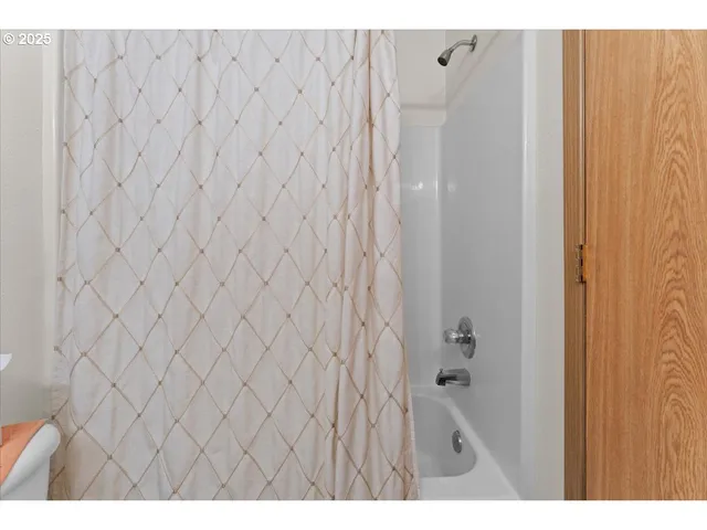 a bathroom with a shower curtain