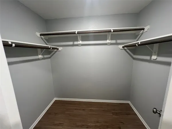 a view of an empty walk in closet