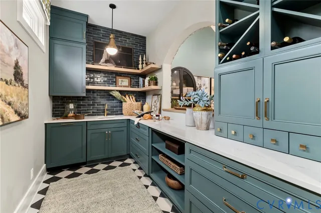 a kitchen with a sink and a stove