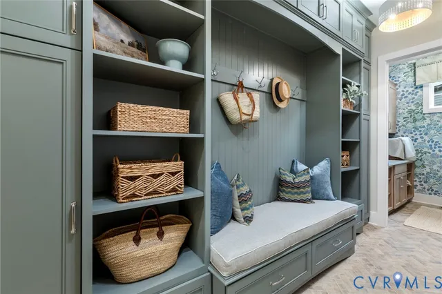 a living room with furniture and a wall painting