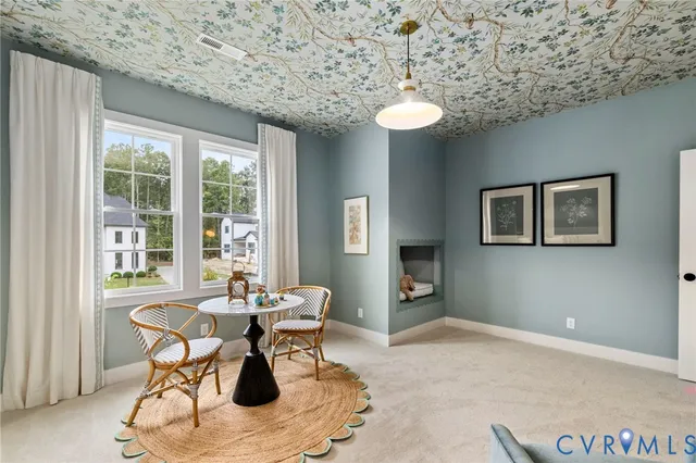 a dining room with furniture and window