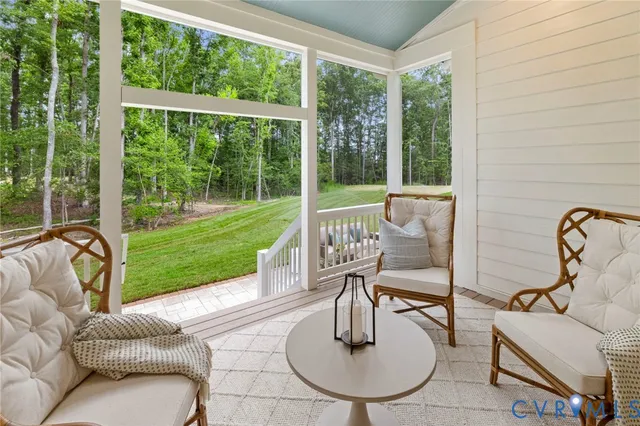 a living room with furniture and a garden