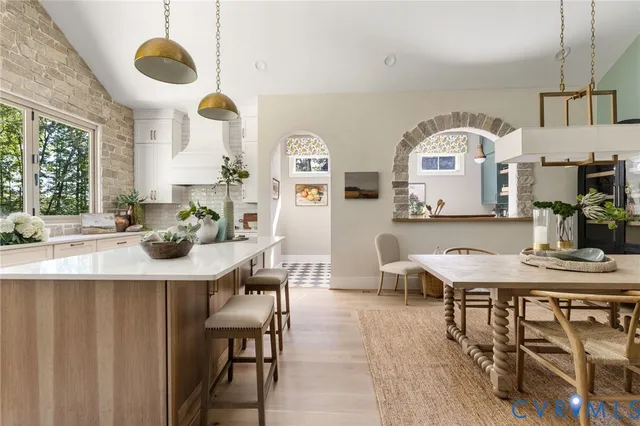 a view of kitchen island dining table and chairs