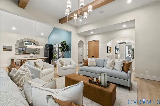 a living room with furniture ceiling fan and a rug