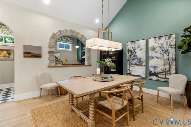 a view of a dining room with furniture and a large window